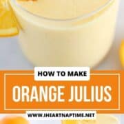 Orange julius in a glass garnished with an orange slice.