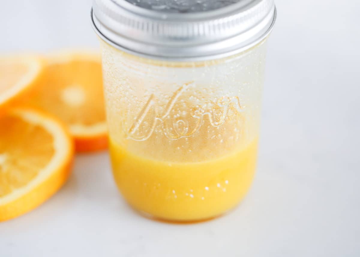 Orange salad dressing in a jar.