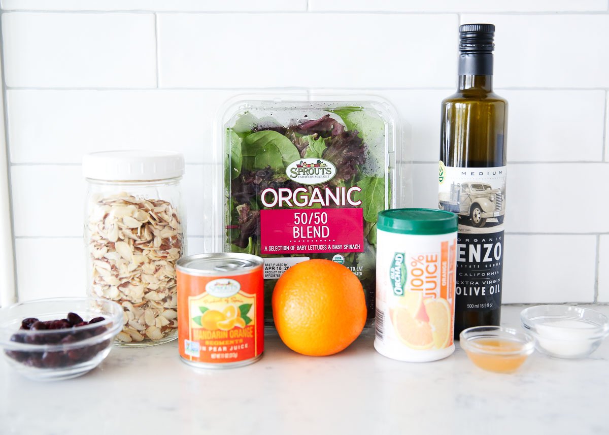 Orange salad ingredients on counter.