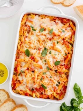 Mostaccioli baked in a white dish.