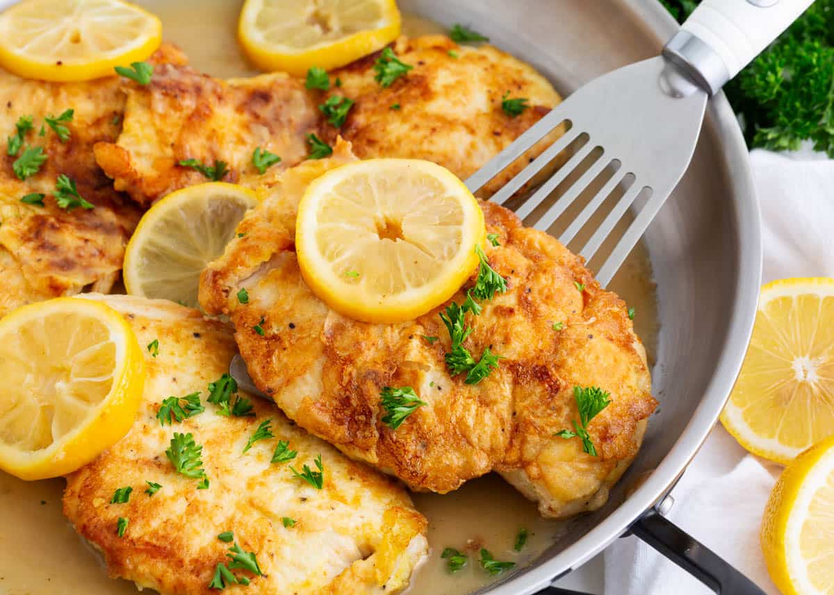 Chicken francese cooked in a skillet. 