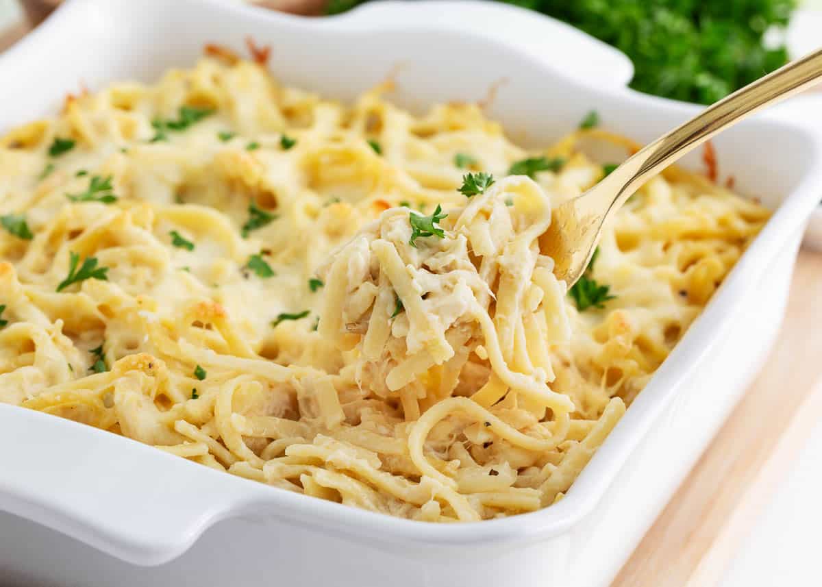 Chicken tetrazzini recipe baked in a white dish. 