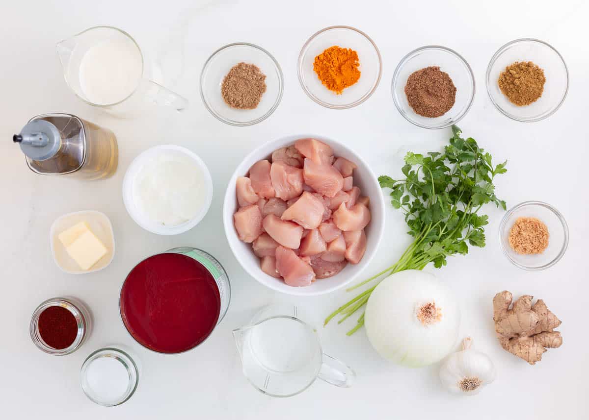 Chicken tikka masala ingredients on counter.