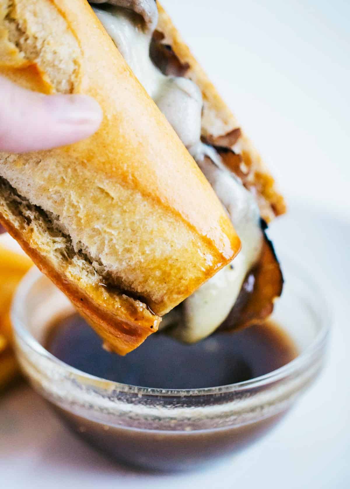 French dip sandwich dipped in au jus sauce. 