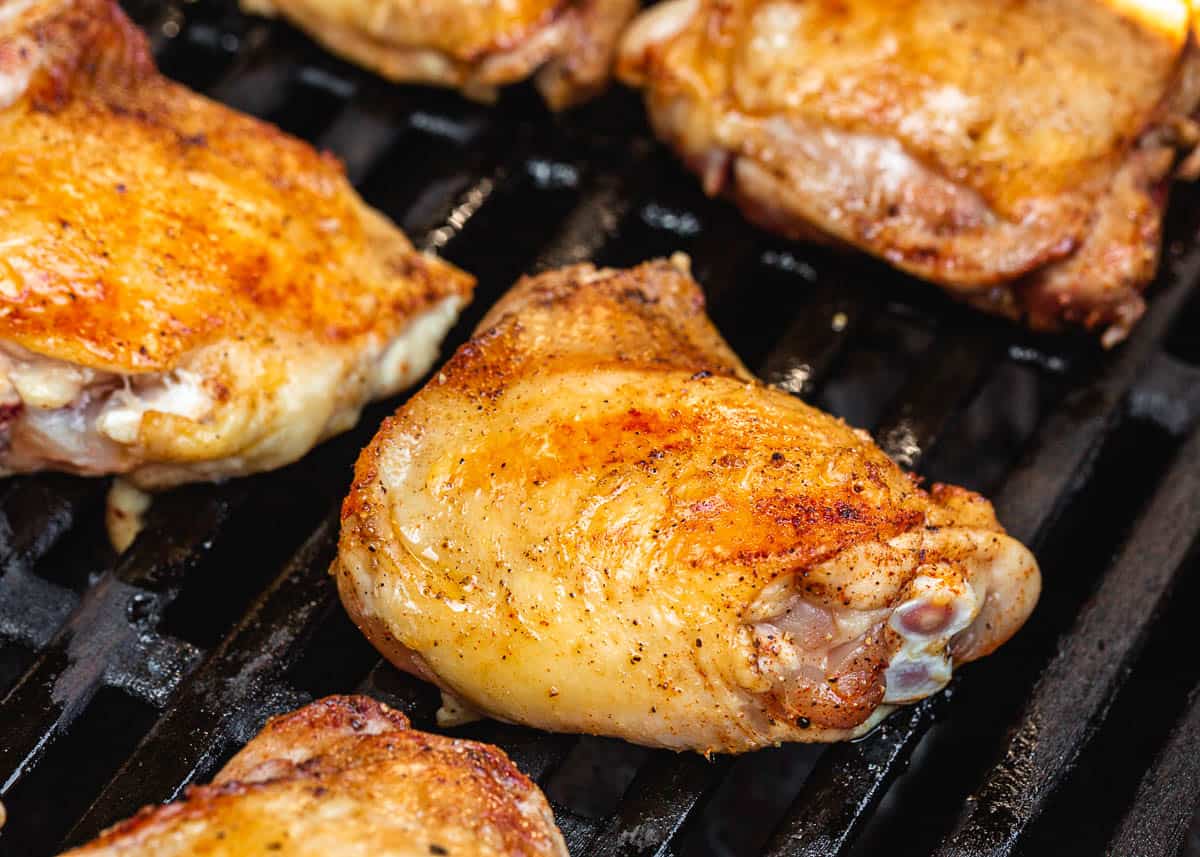Chicken with skin side up on grill.