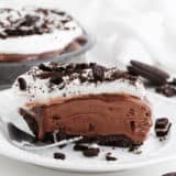 Slice of mud pie on a white plate.