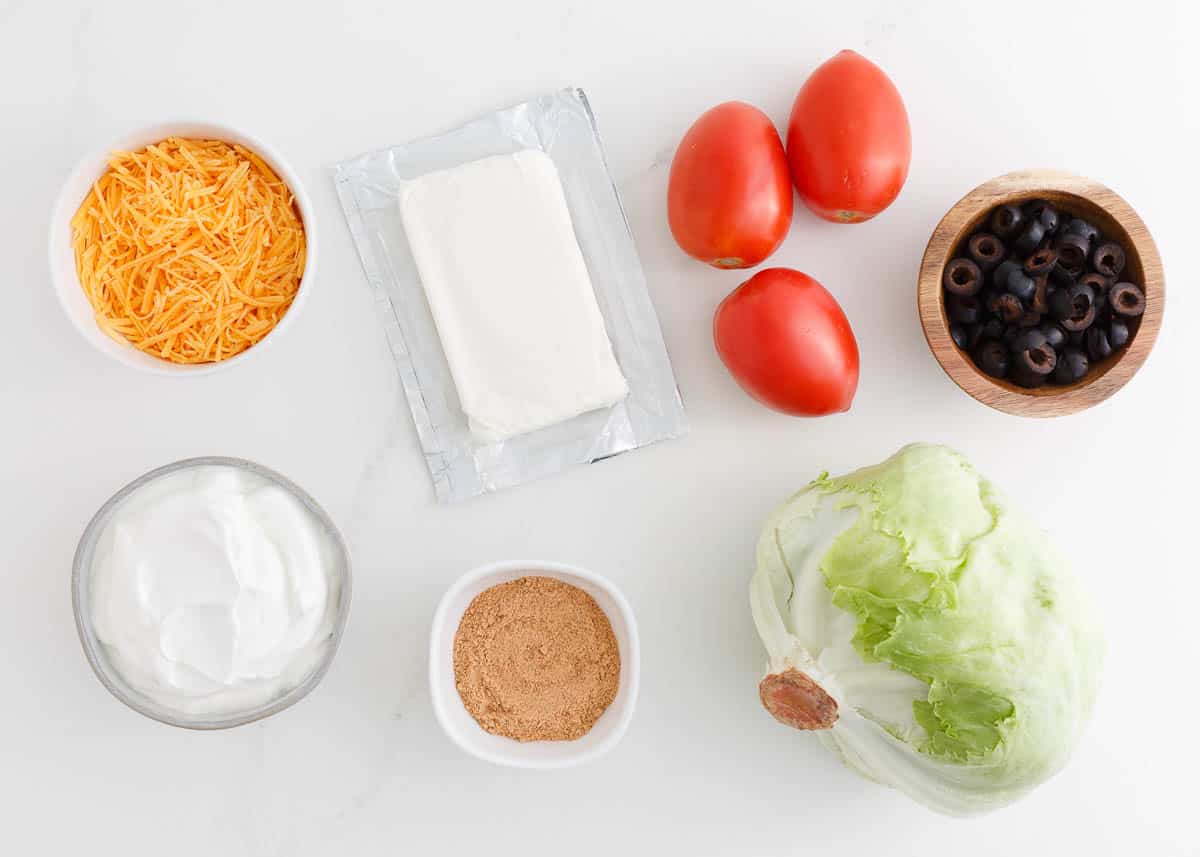 Taco dip ingredients on counter.