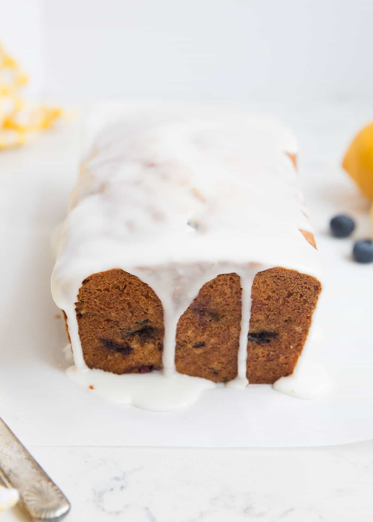 Blueberry zucchini bread with glaze over top. 