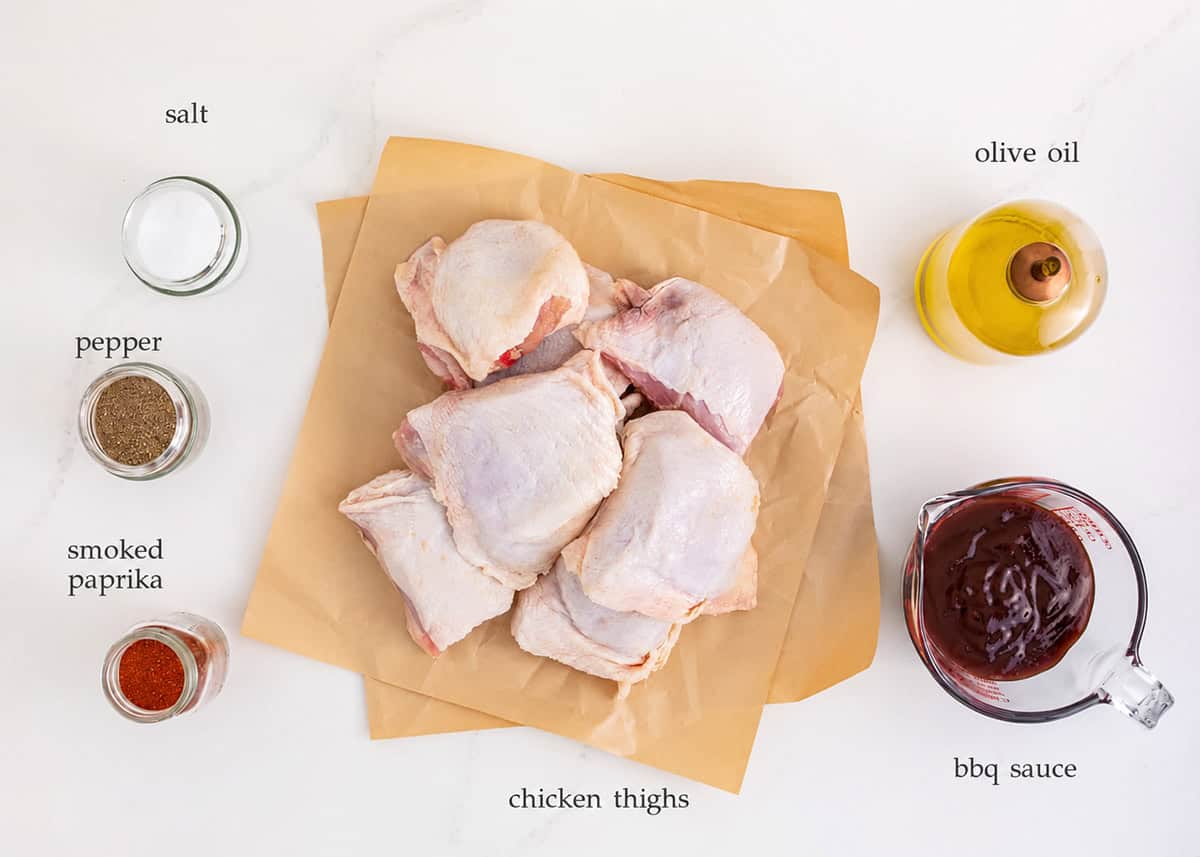 This grilled BBQ chicken is made with simple dry rub and then basted with BBQ sauce for an easy recipe that is tender, juicy and mouth watering any night of the week! Grilled BBQ chicken thigh ingredients including chicken thighs, BBQ sauce, salt, pepper and olive oil.