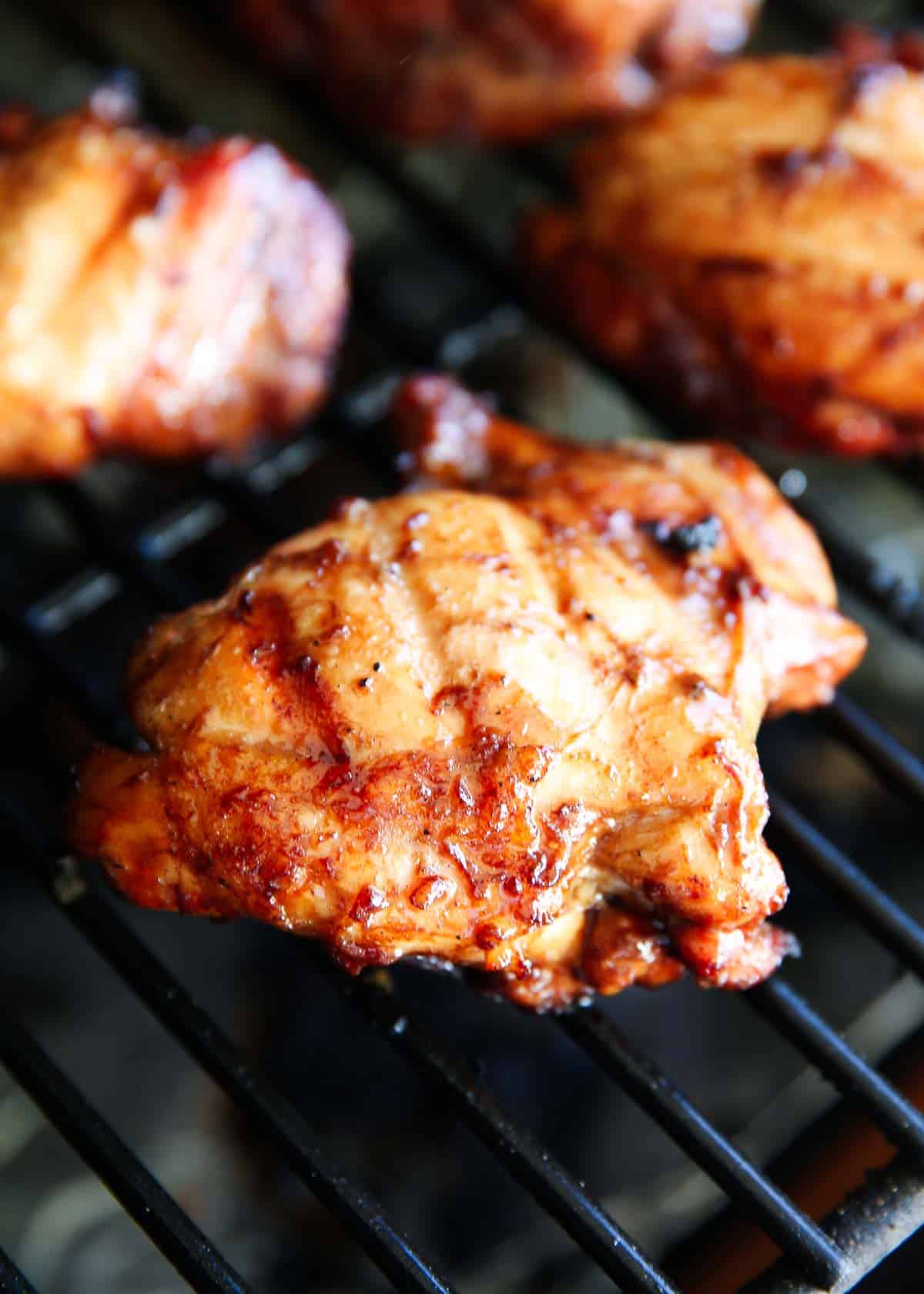Grilled chicken thighs on the grill.