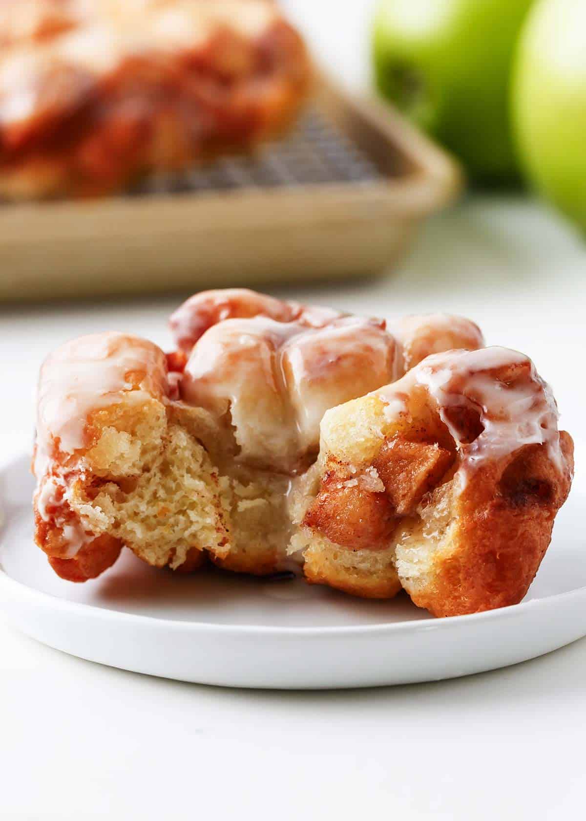 Apple fritters on a white plate.