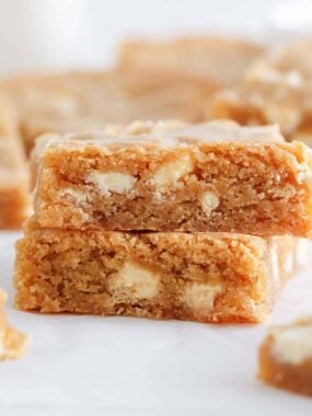 Stack of blondies on a paper.