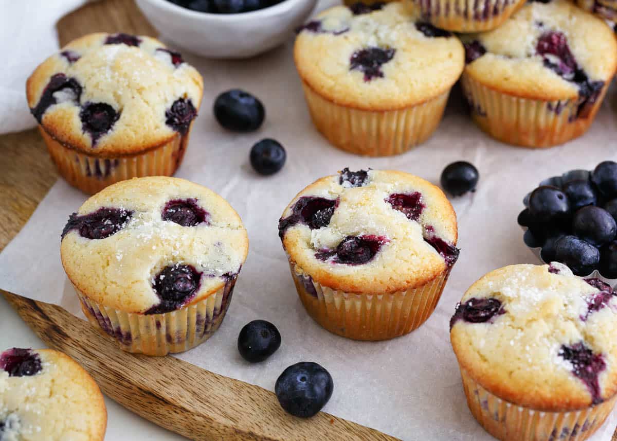 Blueberry muffins on wooden board.