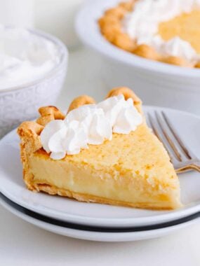 Slice of buttermilk pie on a plate.