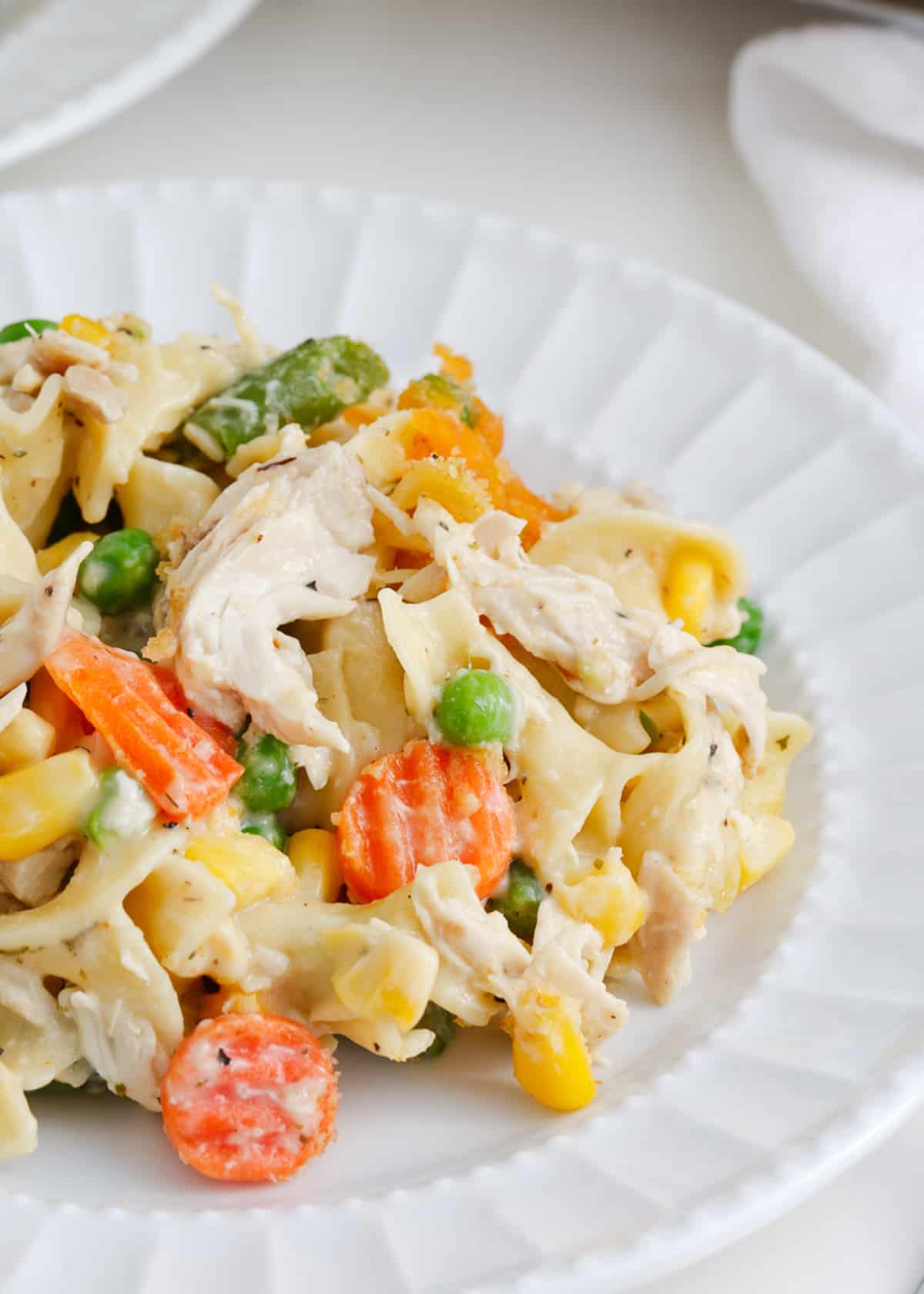 Chicken noodle casserole on a white plate.