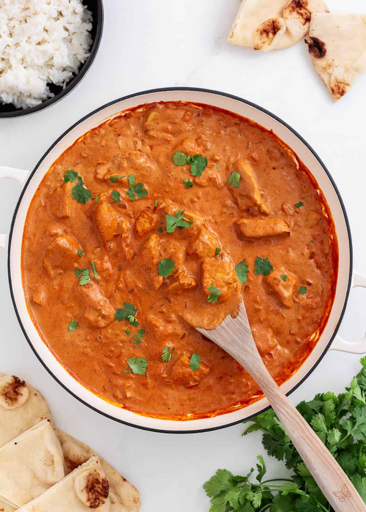 Chicken tikka masala cooking in a pot.