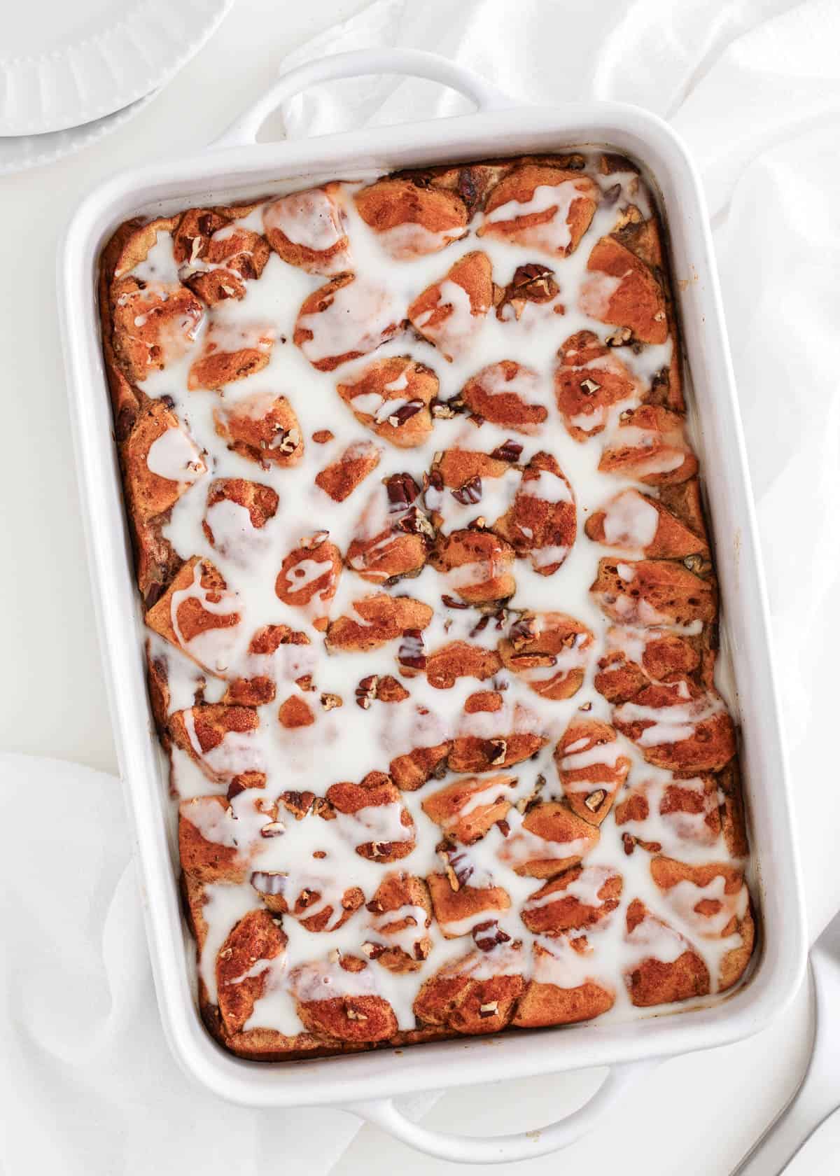 Cinnamon roll casserole in a white dish.