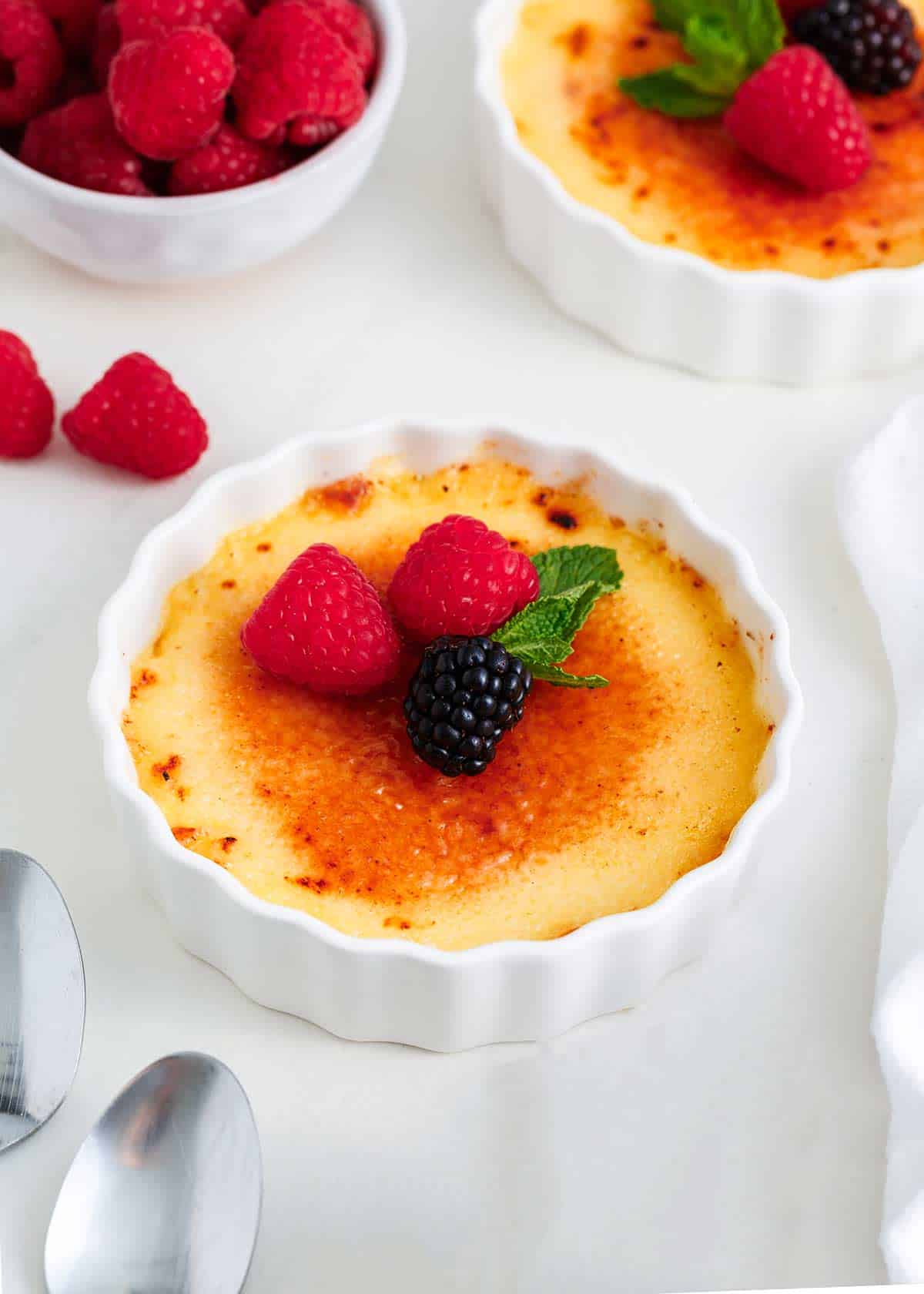 Creme brulee in a white baking dish.