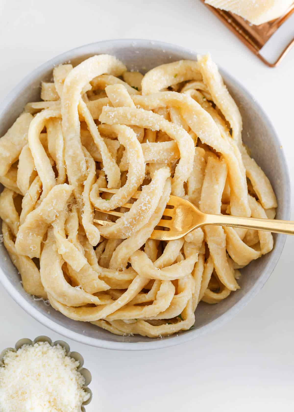 Homemade egg noodles in a bowl.