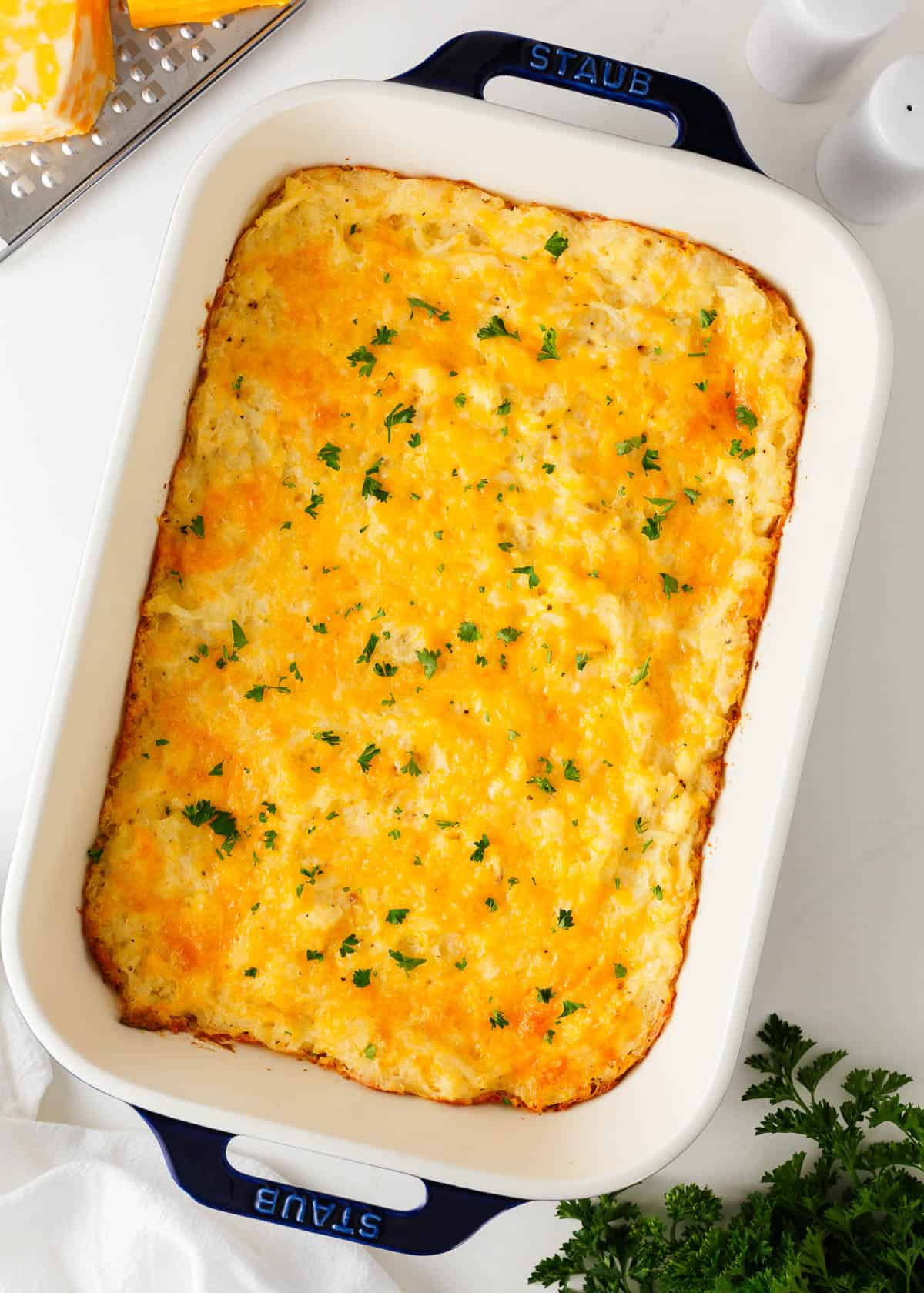 Hashbrown casserole cooked in a baking dish.