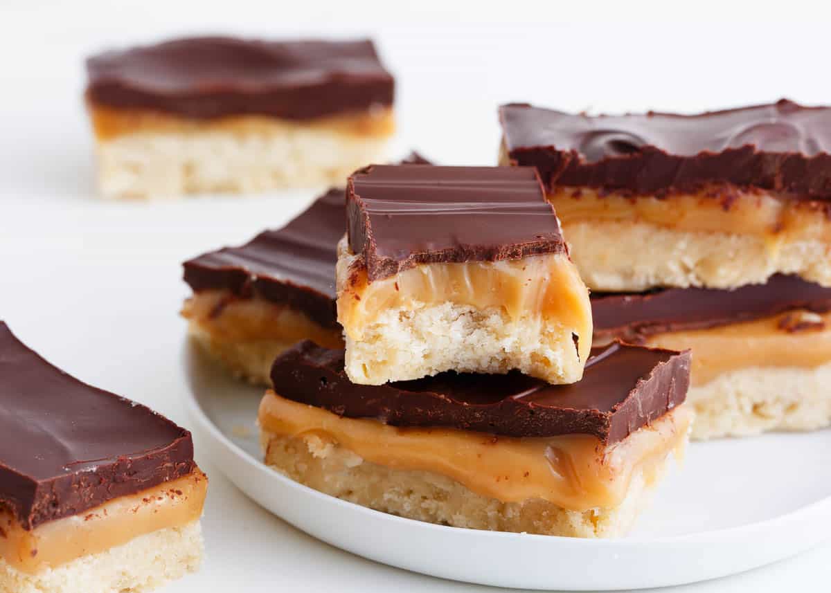 Twix bars on a white plate.