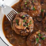 Salisbury steak in a skillet.