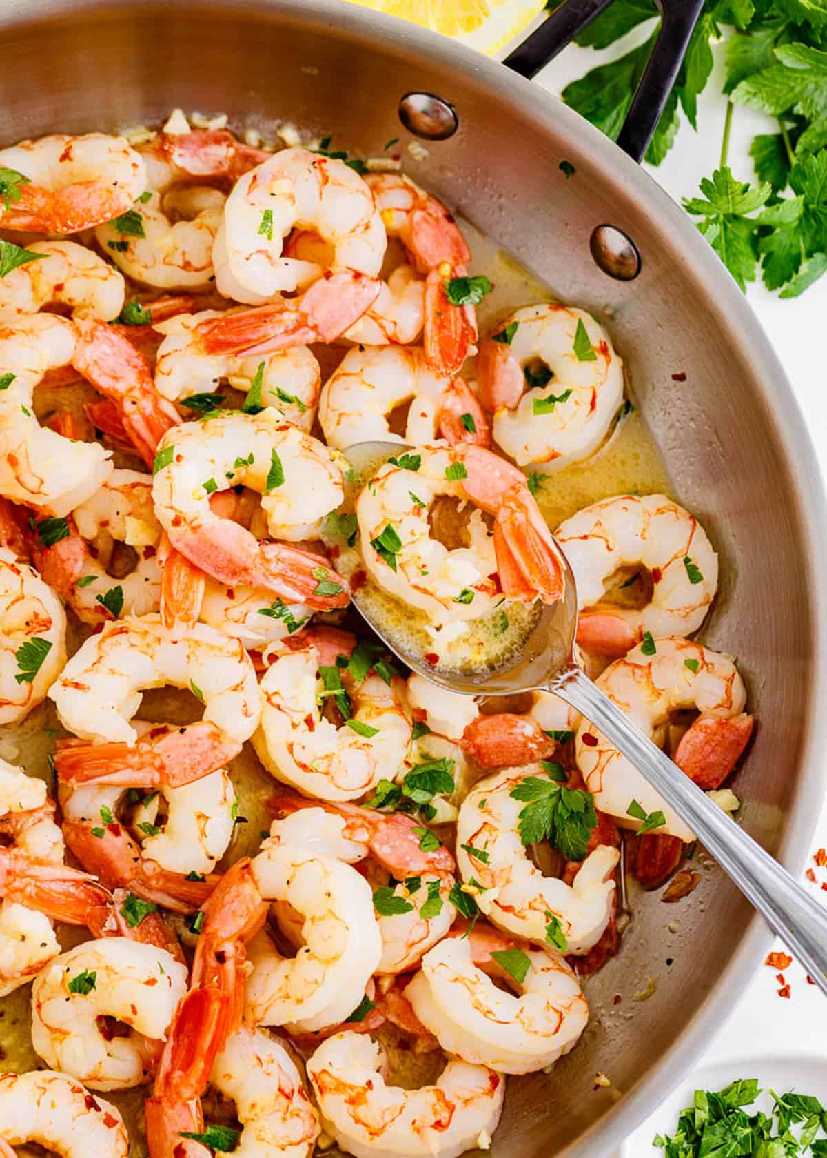 Cooking shrimp scampi in a pot.