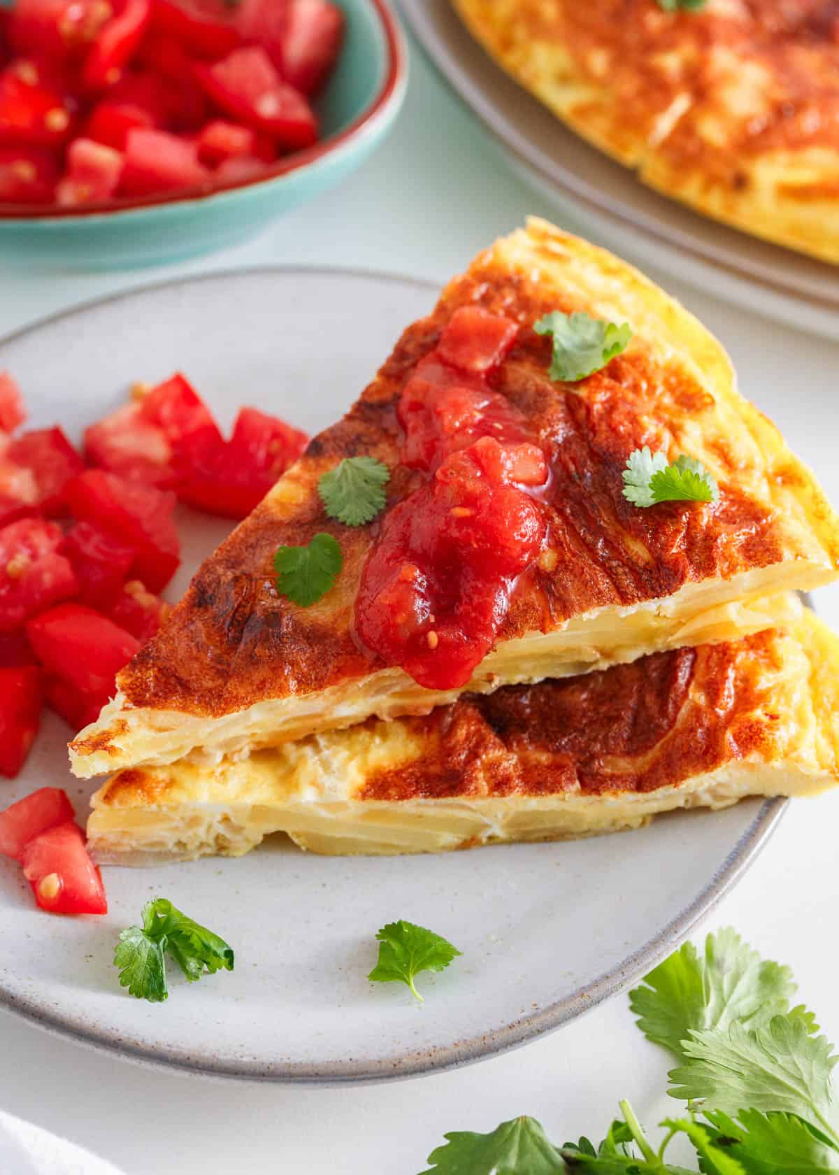 Slices of spanish omelette on a plate.