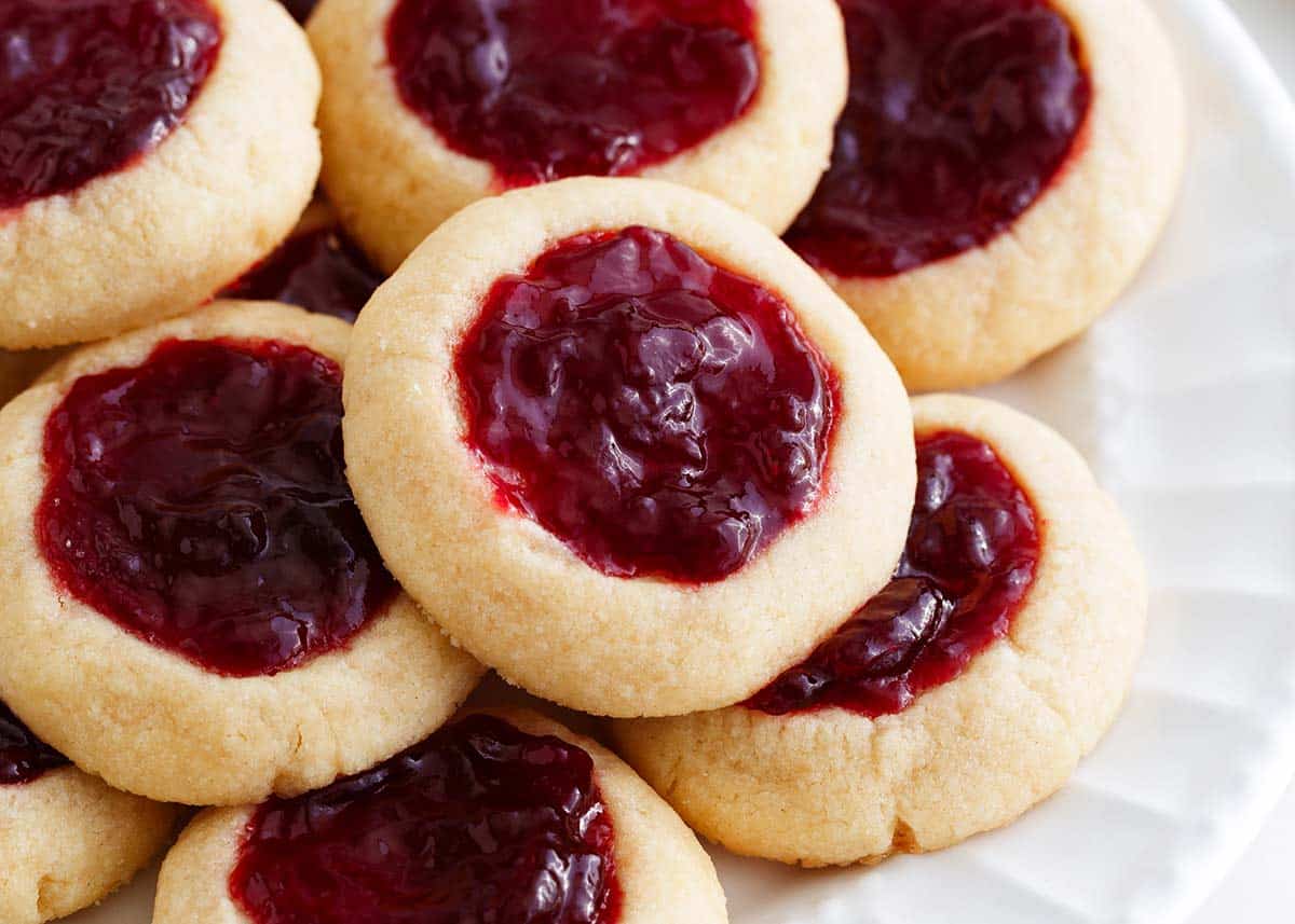 Thumbprint cookies on a white plate.