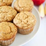 Applesauce muffins on a plate.