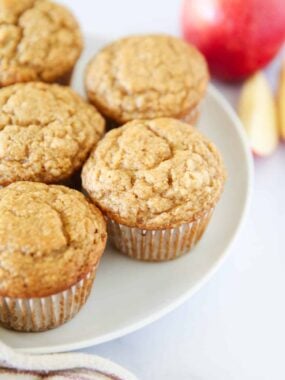 Applesauce muffins on a plate.