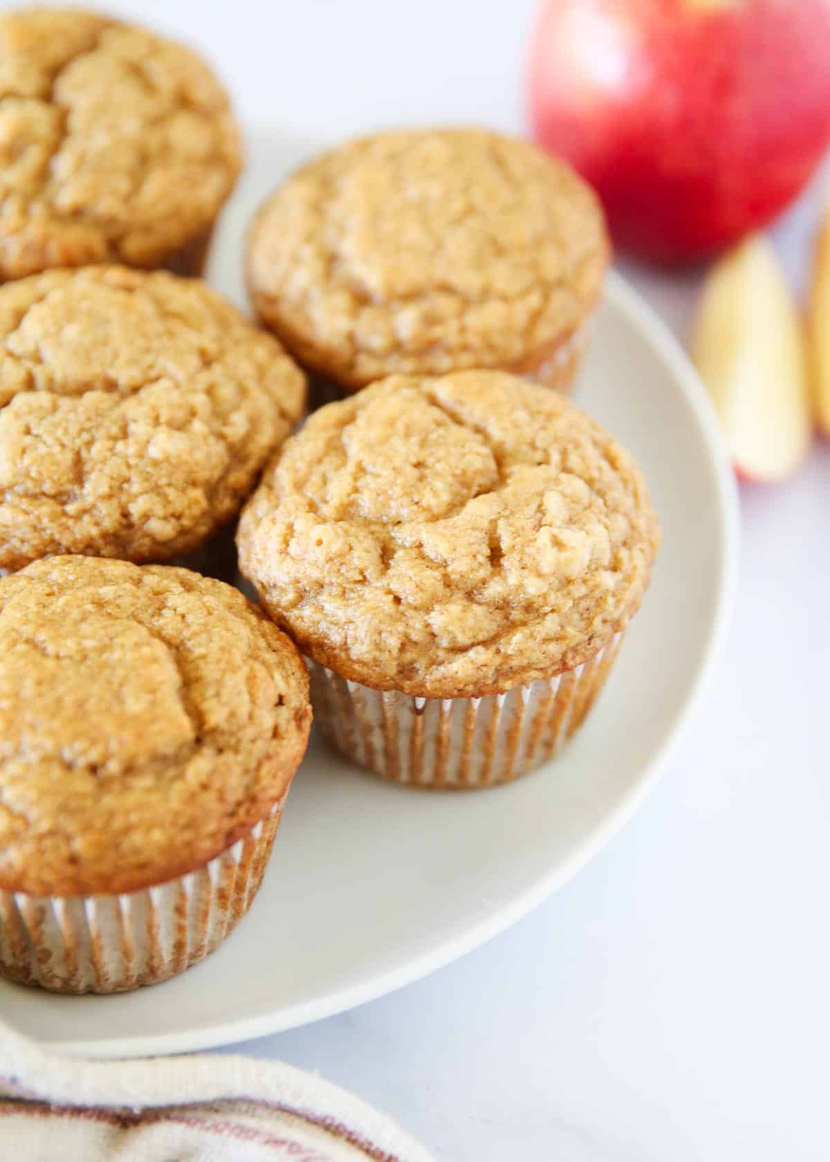 Applesauce muffins on a plate.