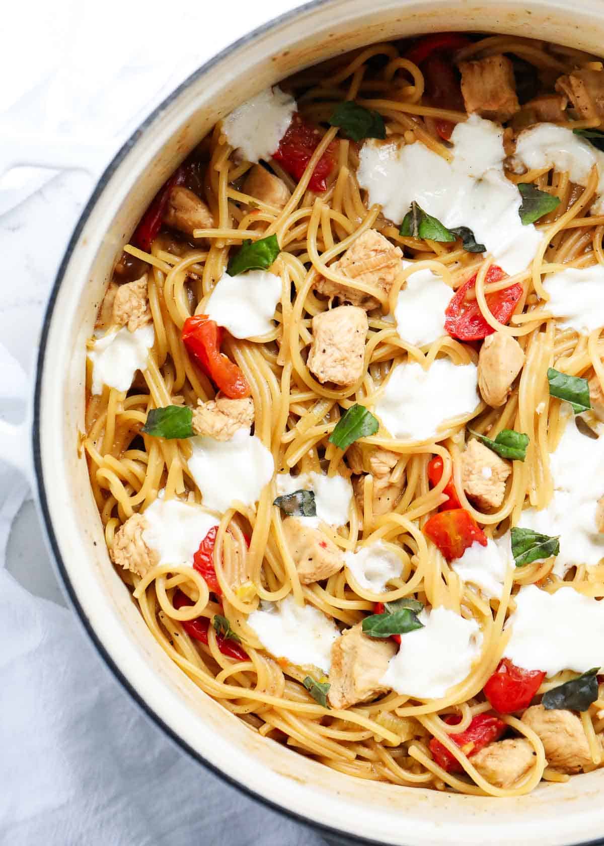 Caprese chicken pasta in a large pot. 