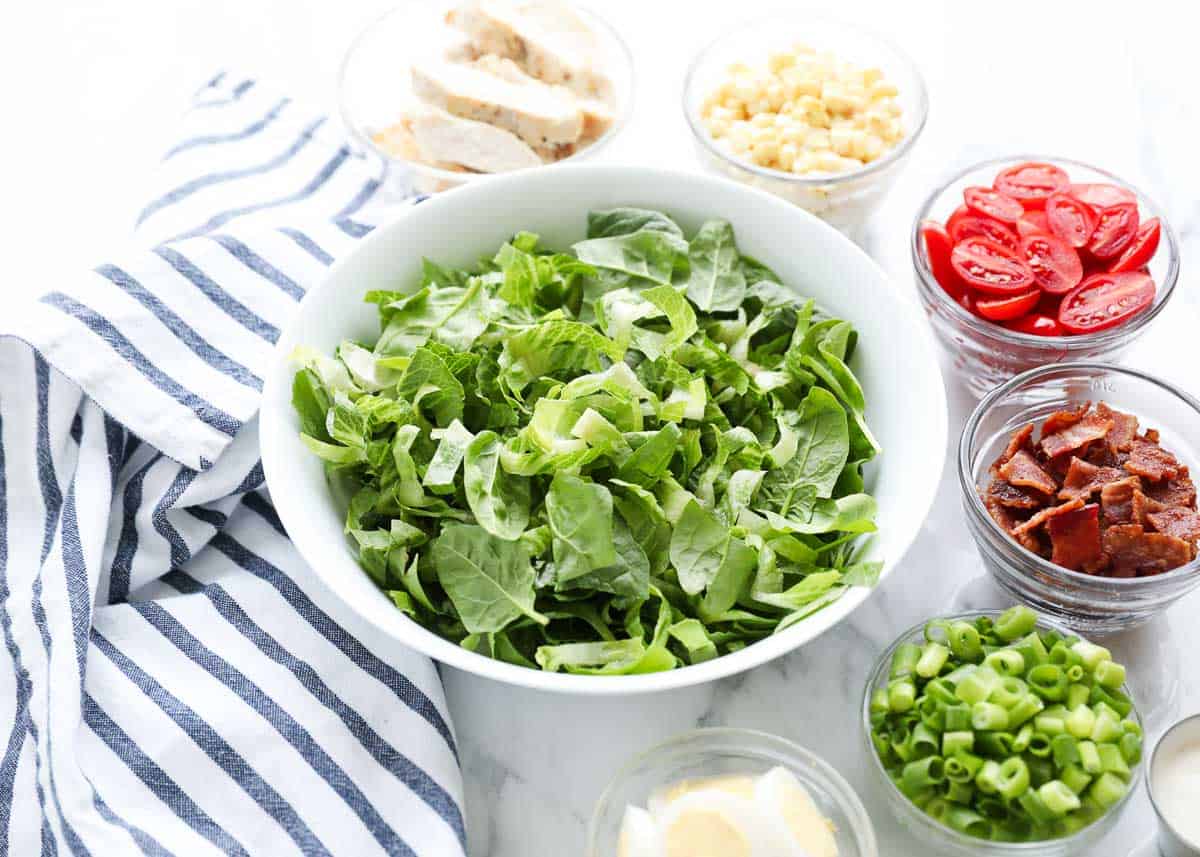 Ingredients in separate bowls for cobb salad. 