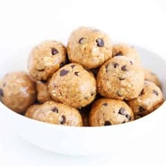 Homemade no-bake energy balls stacked in a bowl for an easy bite-sized snack.