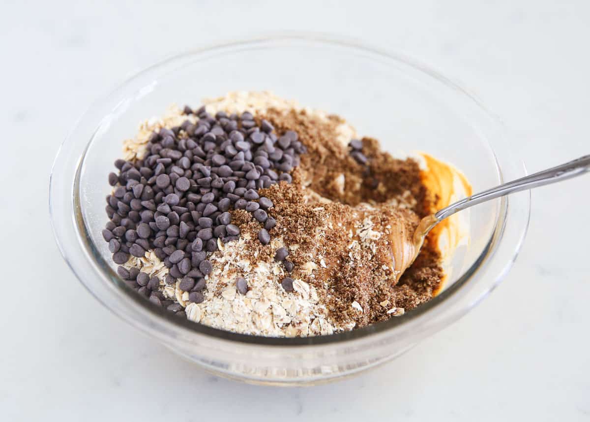 Showing how to make energy balls in a glass bowl.