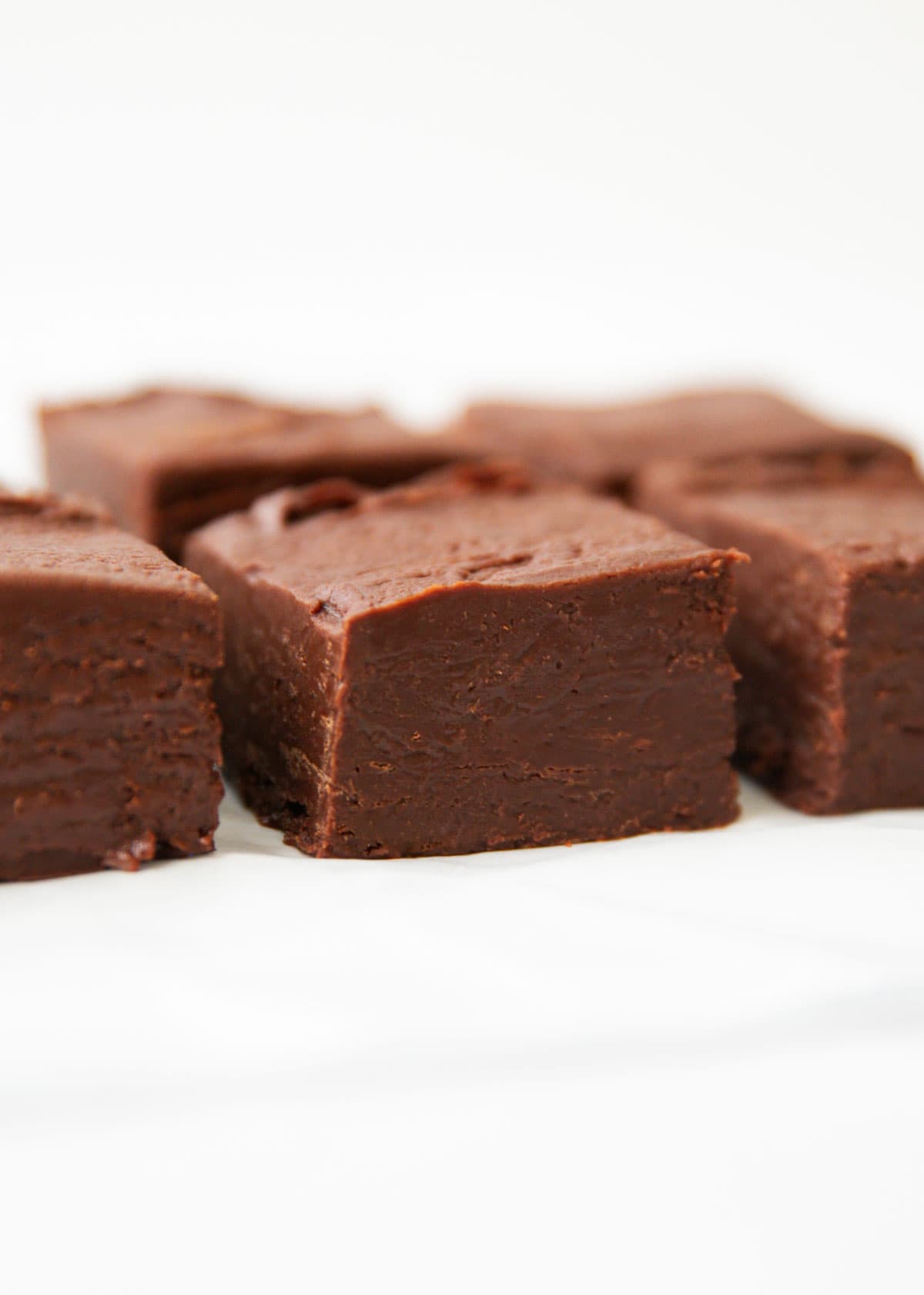 Sliced chocolate fudge on counter.