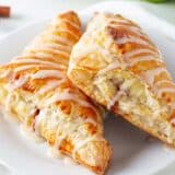 Apple turnovers on a white plate.