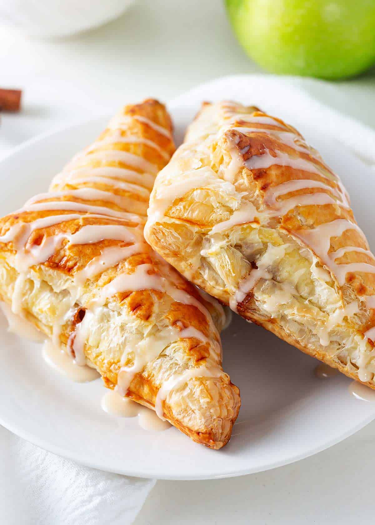 Apple turnovers on a white plate.