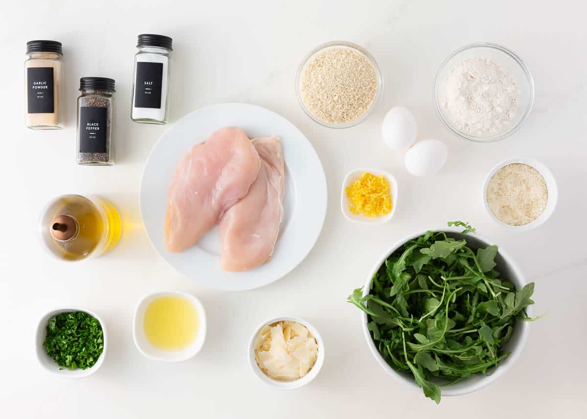 Chicken milanese ingredients on the counter.