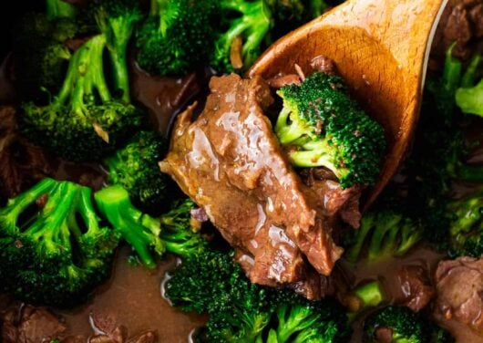 Beef and broccoli cooking in the crockpot.