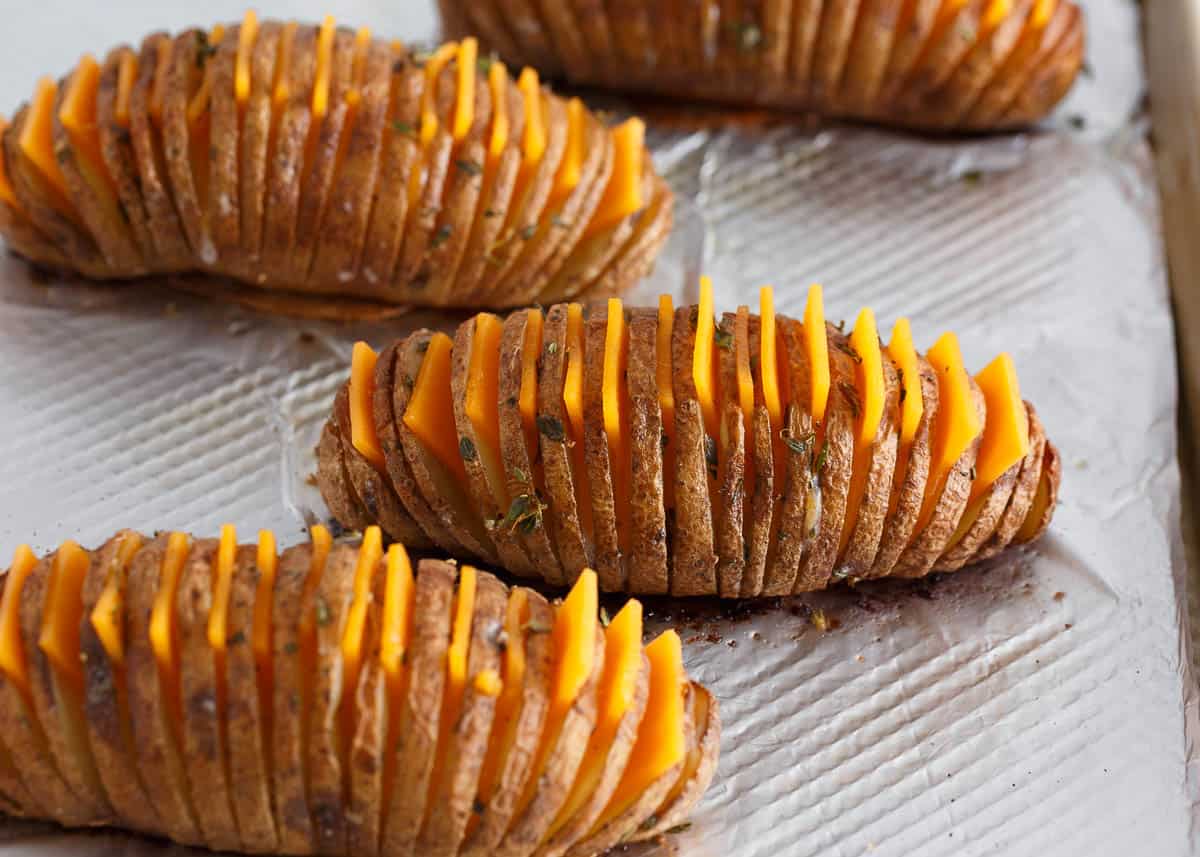Hasselback potatoes with cheese slices. 