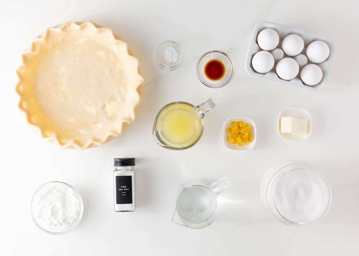 Lemon meringue pie ingredients on counter.