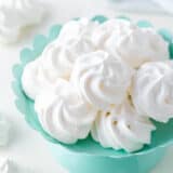 Meringue cookies on a cake platter.