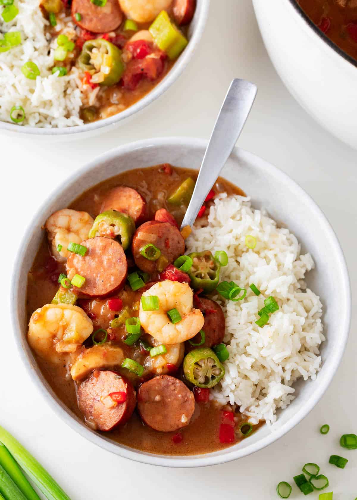 Serving New Orleans gumbo with rice in a white bowl.