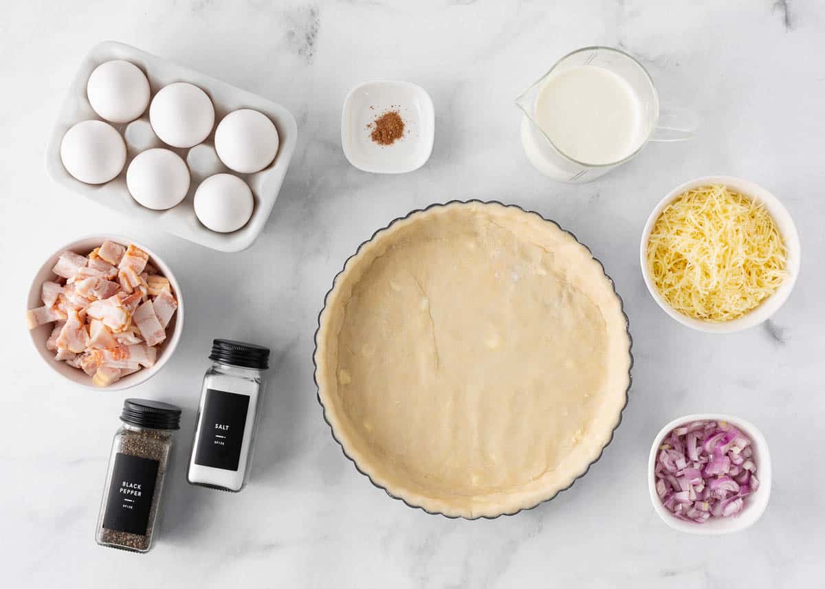 Quiche lorraine ingredients on the counter.