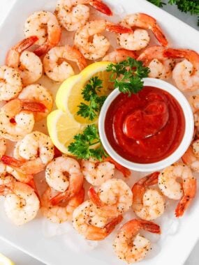 Shrimp cocktail on a white plate.