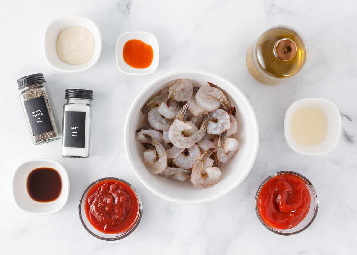 Shrimp cocktail ingredients on counter.