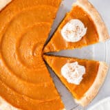 Slices of sweet potato pie in a pie dish.