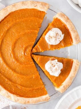 Slices of sweet potato pie in a pie dish.